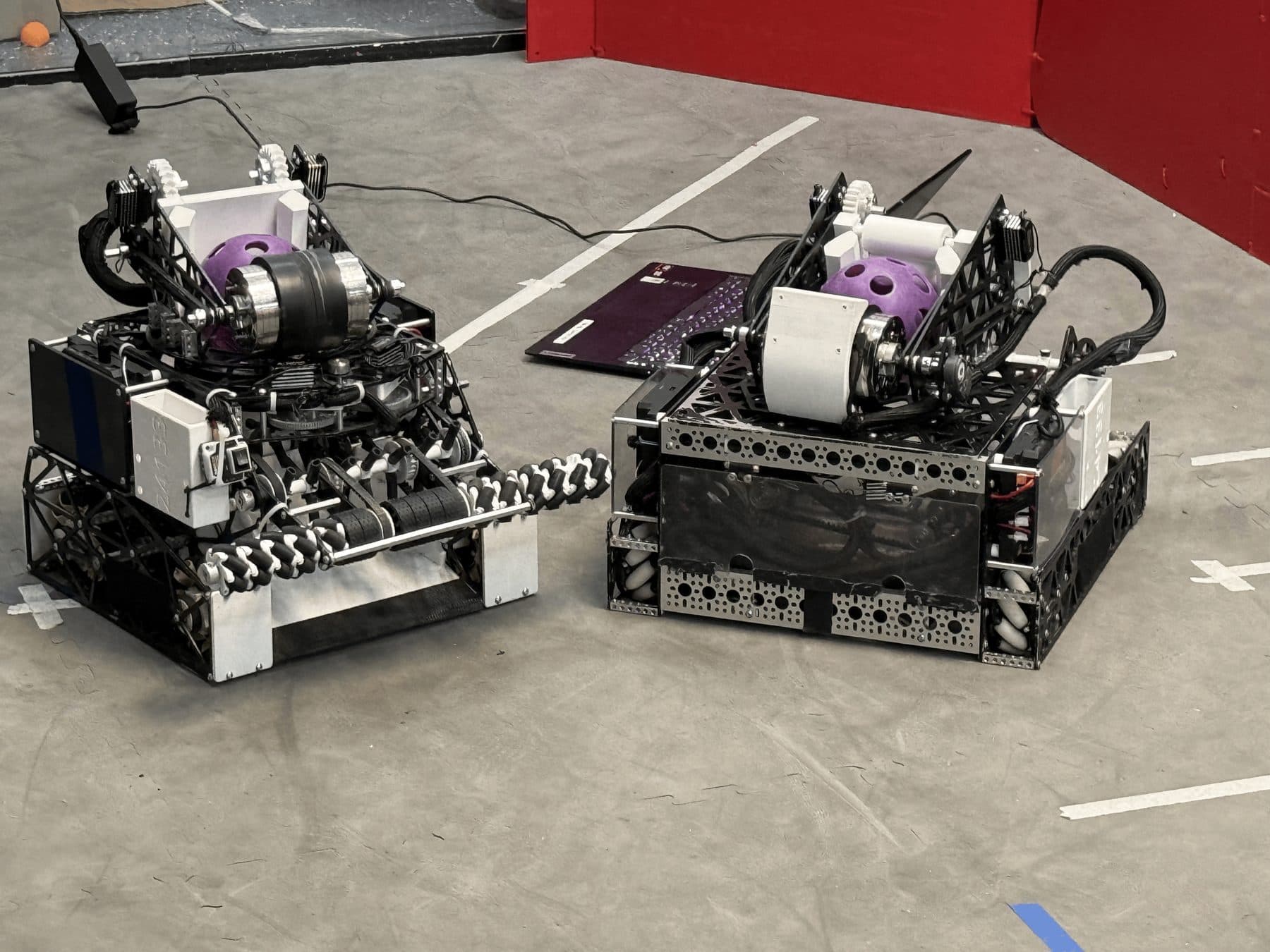 Two FTC robots on the practice field