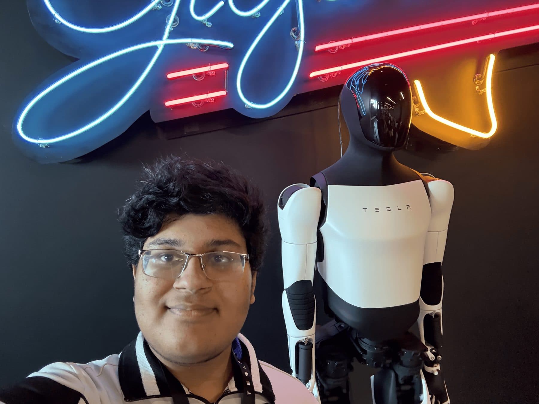 Standing next to a Tesla Optimus humanoid robot